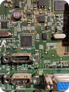 Component-level TV repair showing HDMI circuitry on a television main board after lightning damage repair.
